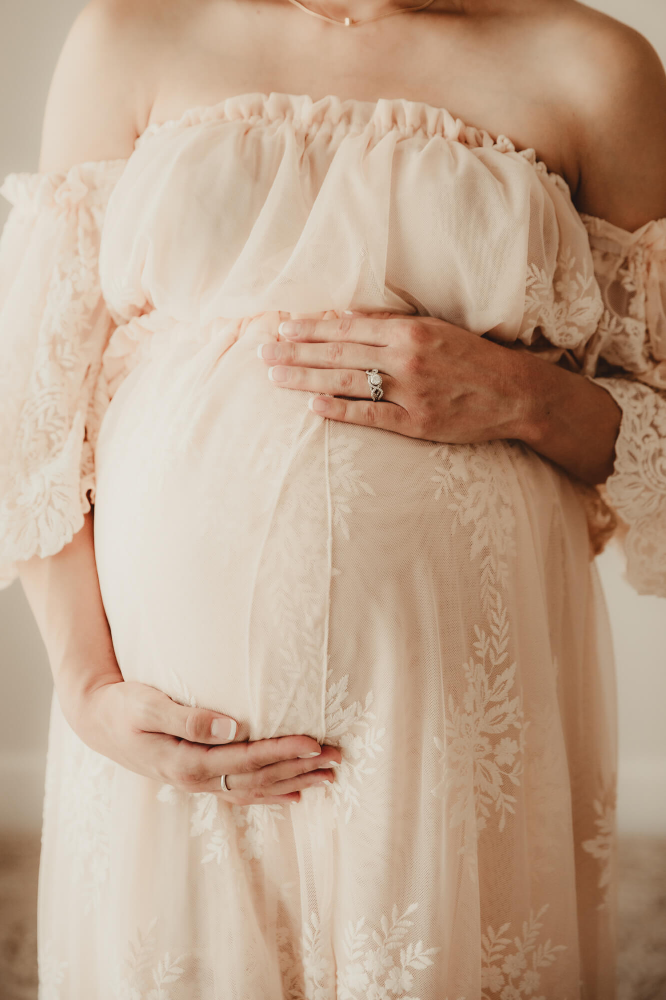 Woman's hands on her baby bump, Dr Goff OKC.