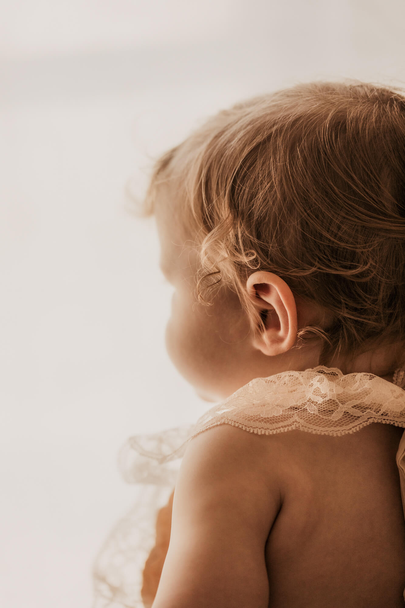 Baby girl hair curls.