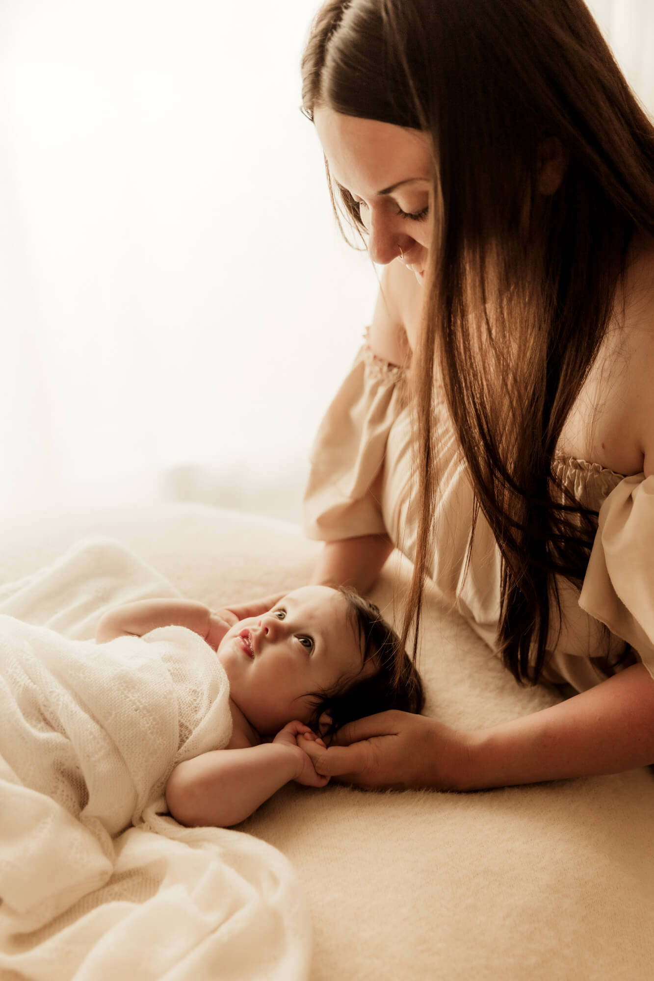 Little girl looks up at her mother, OU Children's Hospital