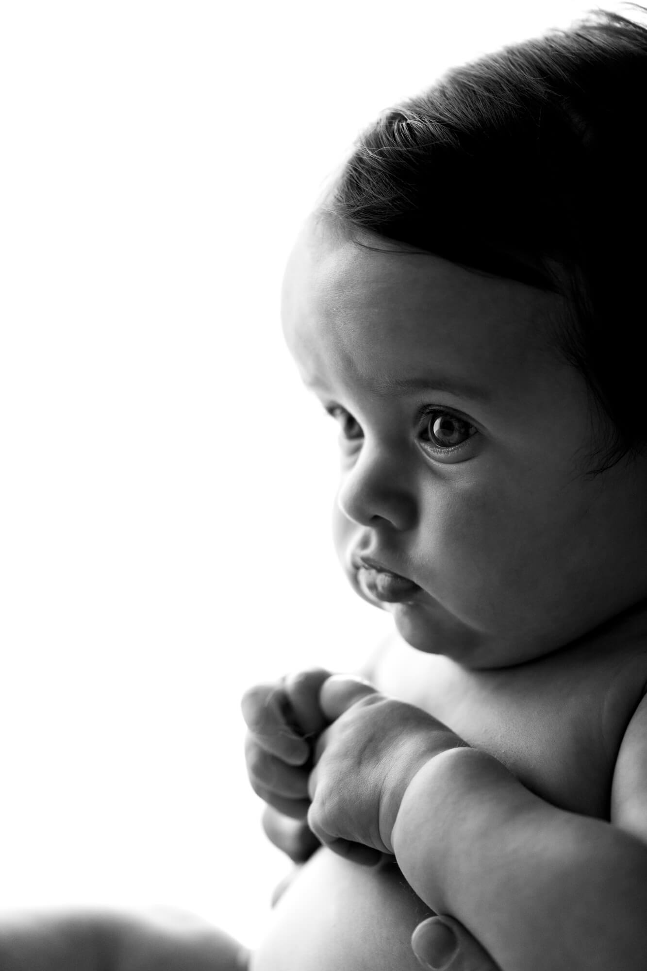 Profile portrait of a baby girl in black & white