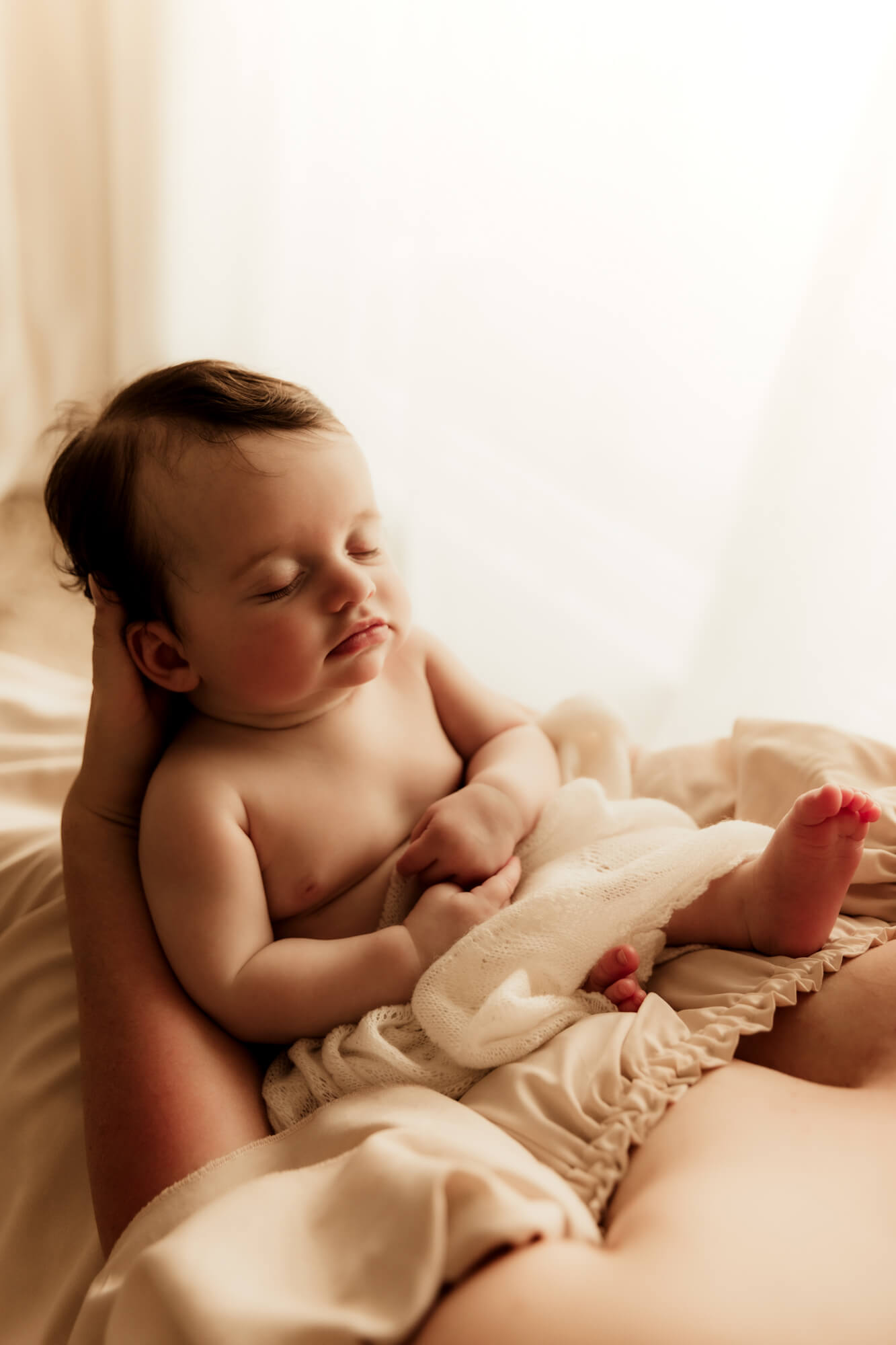 Studio portrait of a 4 month old girl sleeping, OU Children's Hospital