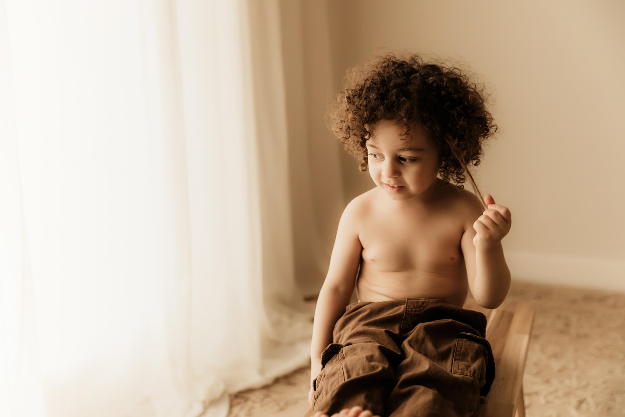 Boy pulls his curls, Sharkey's Cuts for Kids