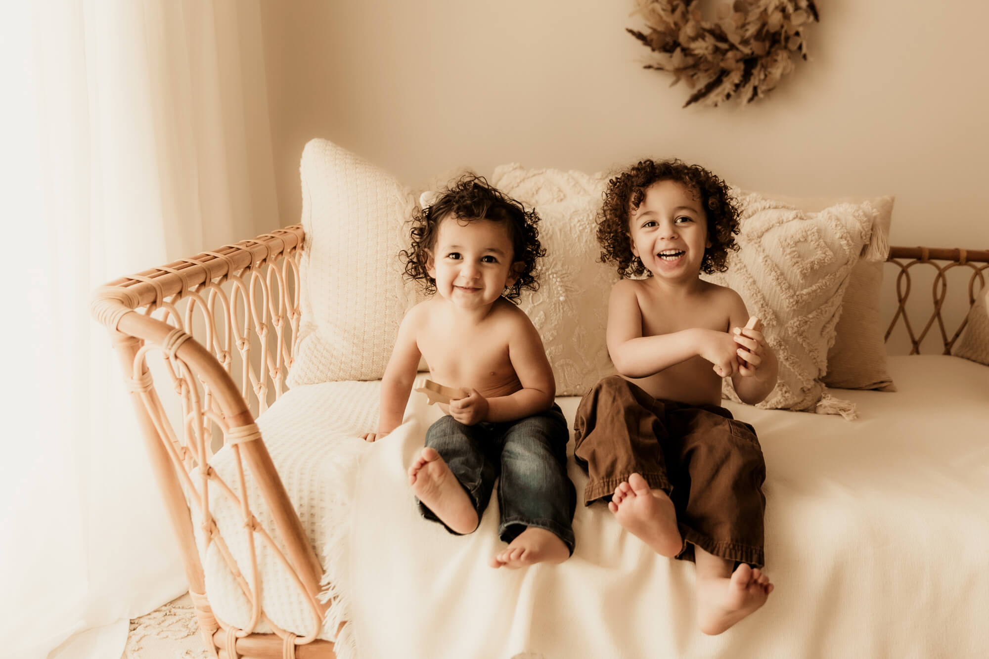 Brothers laughing on a daybed, Sharkey's Cuts for Kids