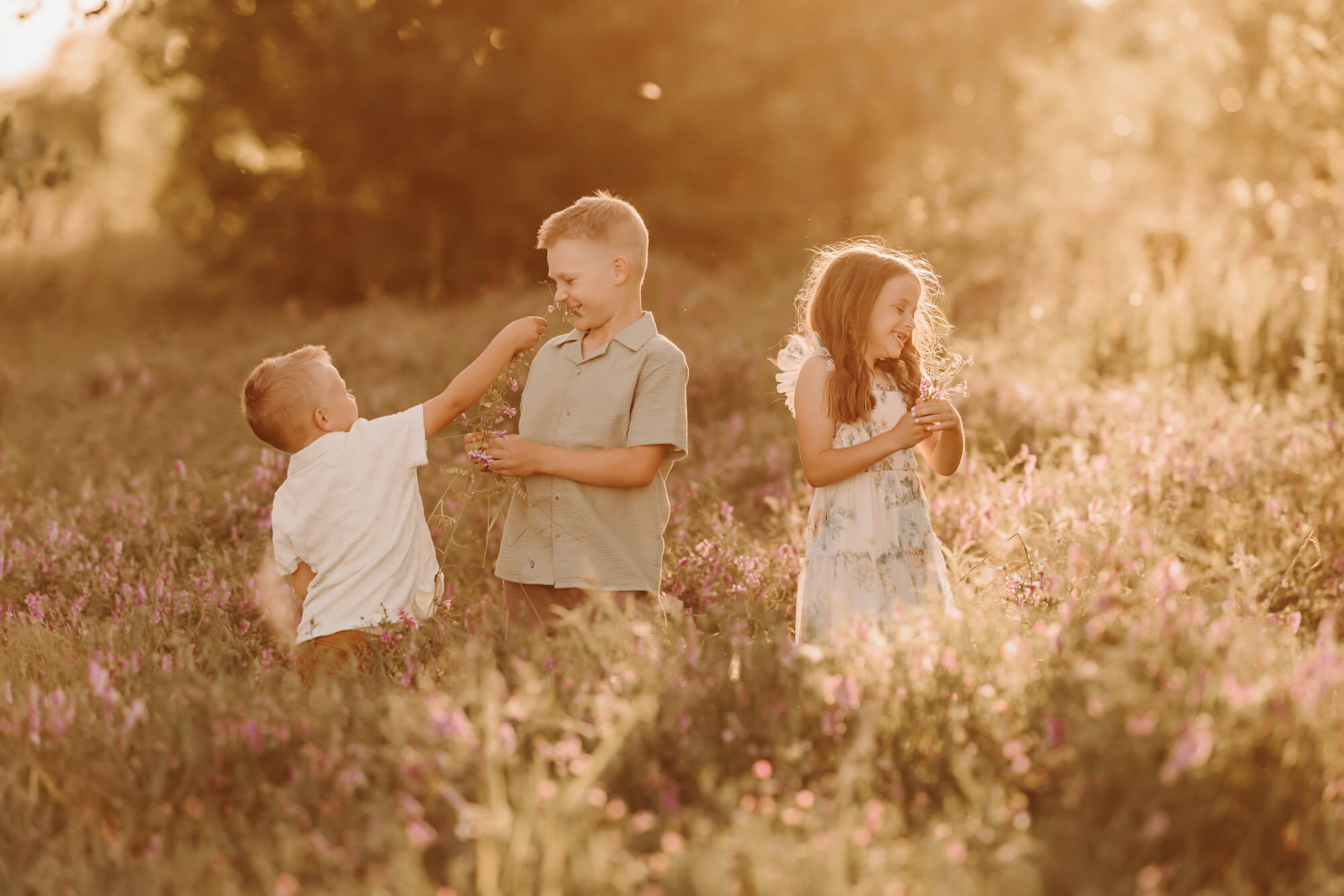 Kids playing in a field near OKC swim lessons.