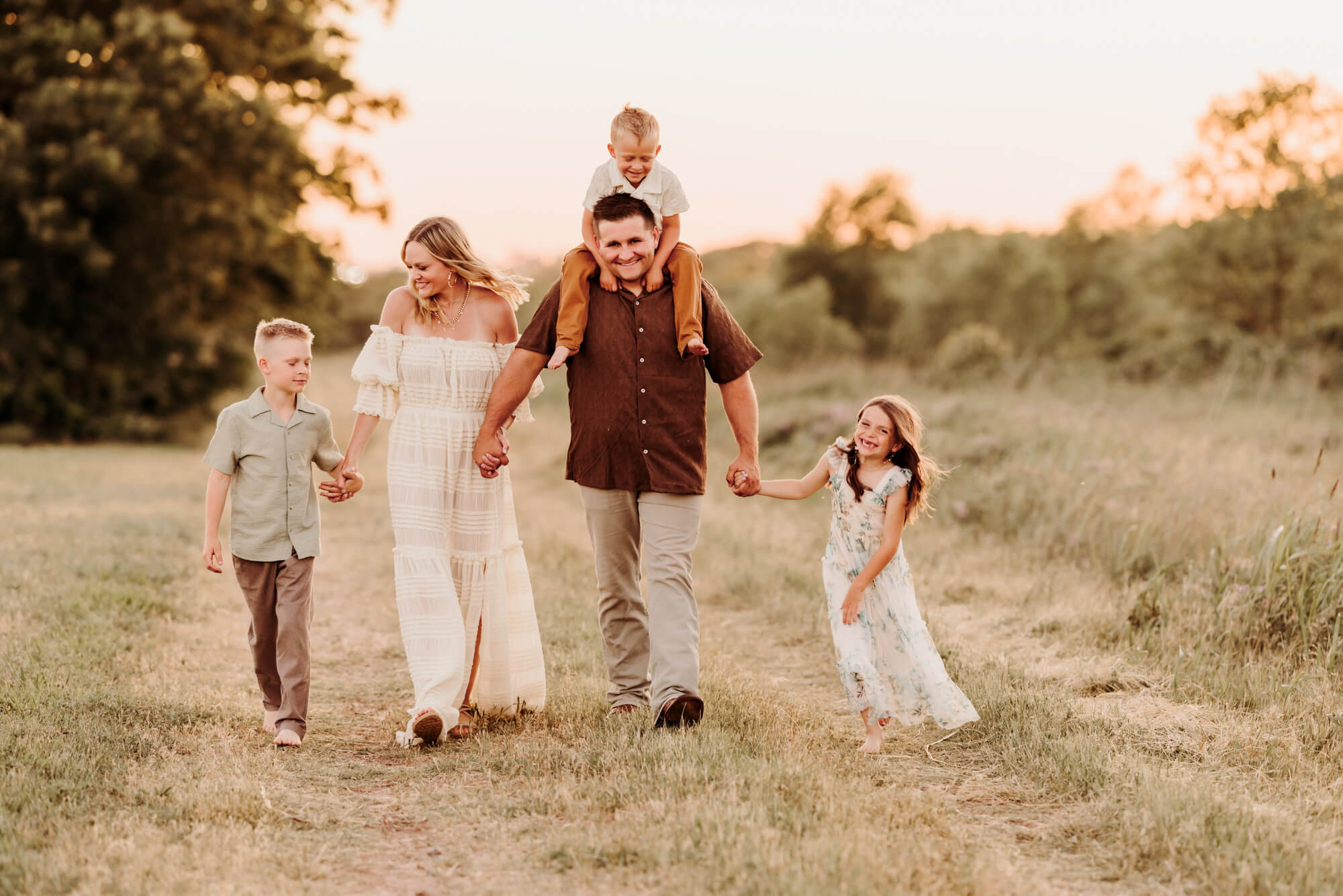 Family of 5 walking down a gravel road and laughing, things to do with kids in Oklahoma City