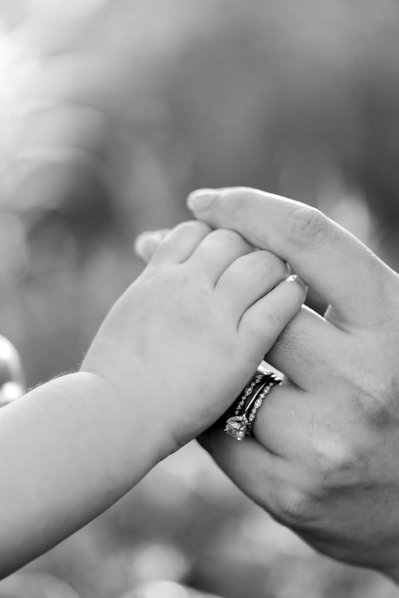 Close up of a mother and daughters hands.