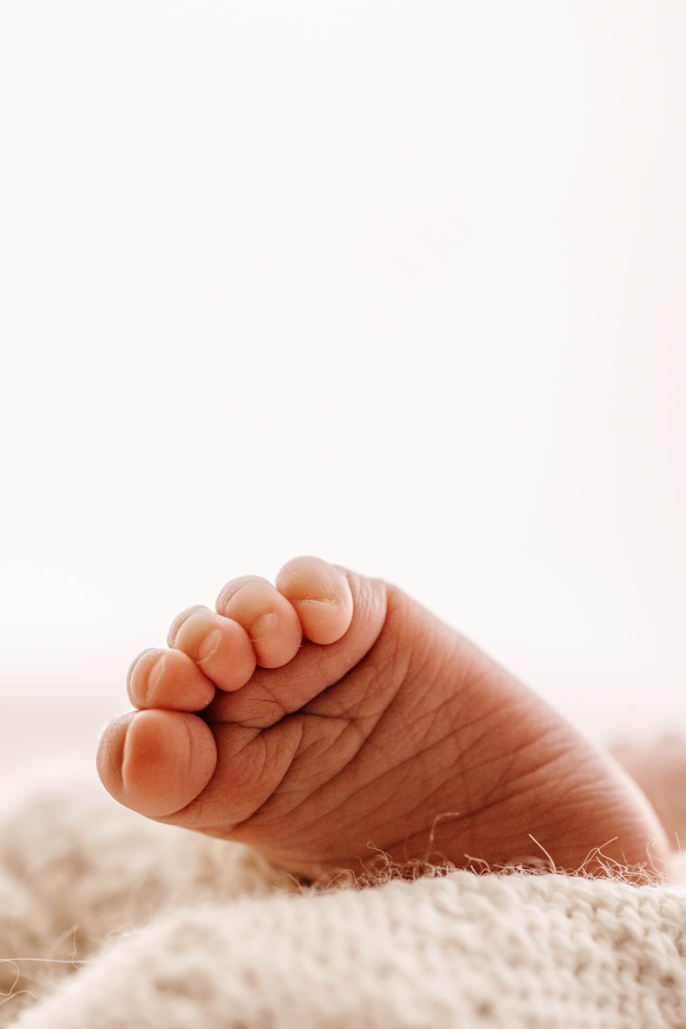 Details of a newborn baby's curled toes